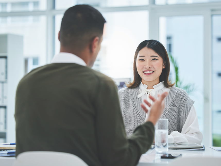 Two people having a meeting about potential recruitment opportunities.